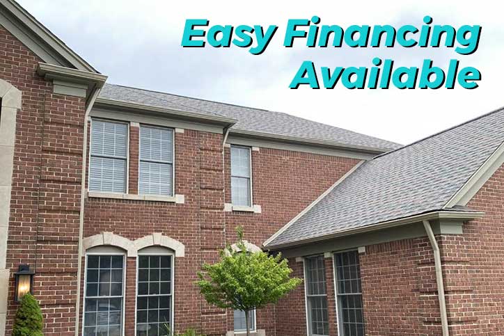 New Gutters on Home with Financing at Top of Image